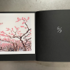 Limited edition, Edition 9, the catalogs are signed and numbered in the endpapers. A 26 x 21 cm photograph by Hoffer Hao on photographic paper is laid in.
